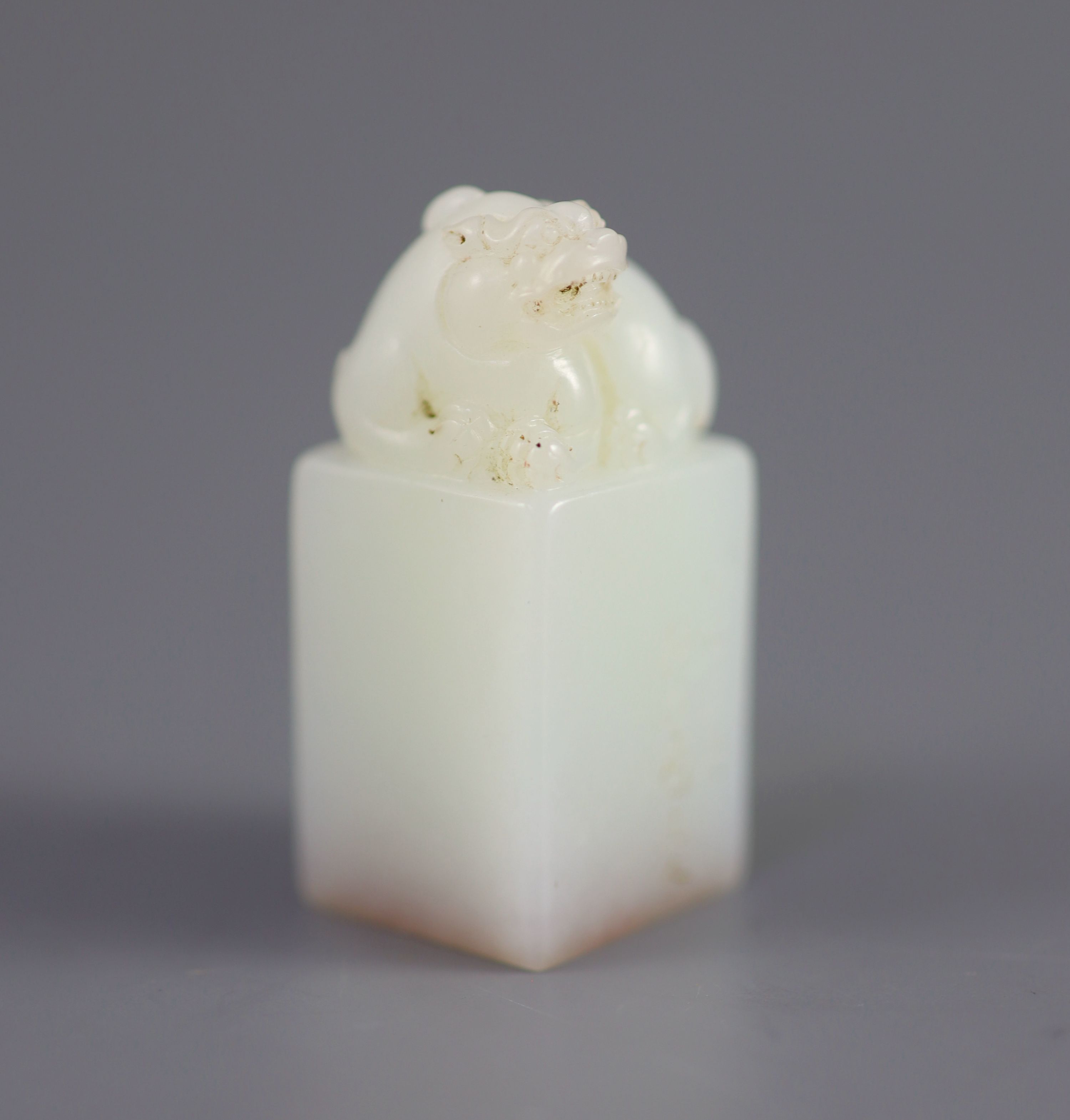 A Chinese inscribed white jade seal, 20th century, 4.3cm